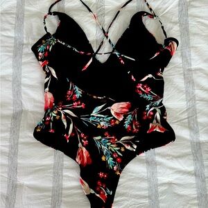O’Neill one piece bathing suit. Black w/ flower details.